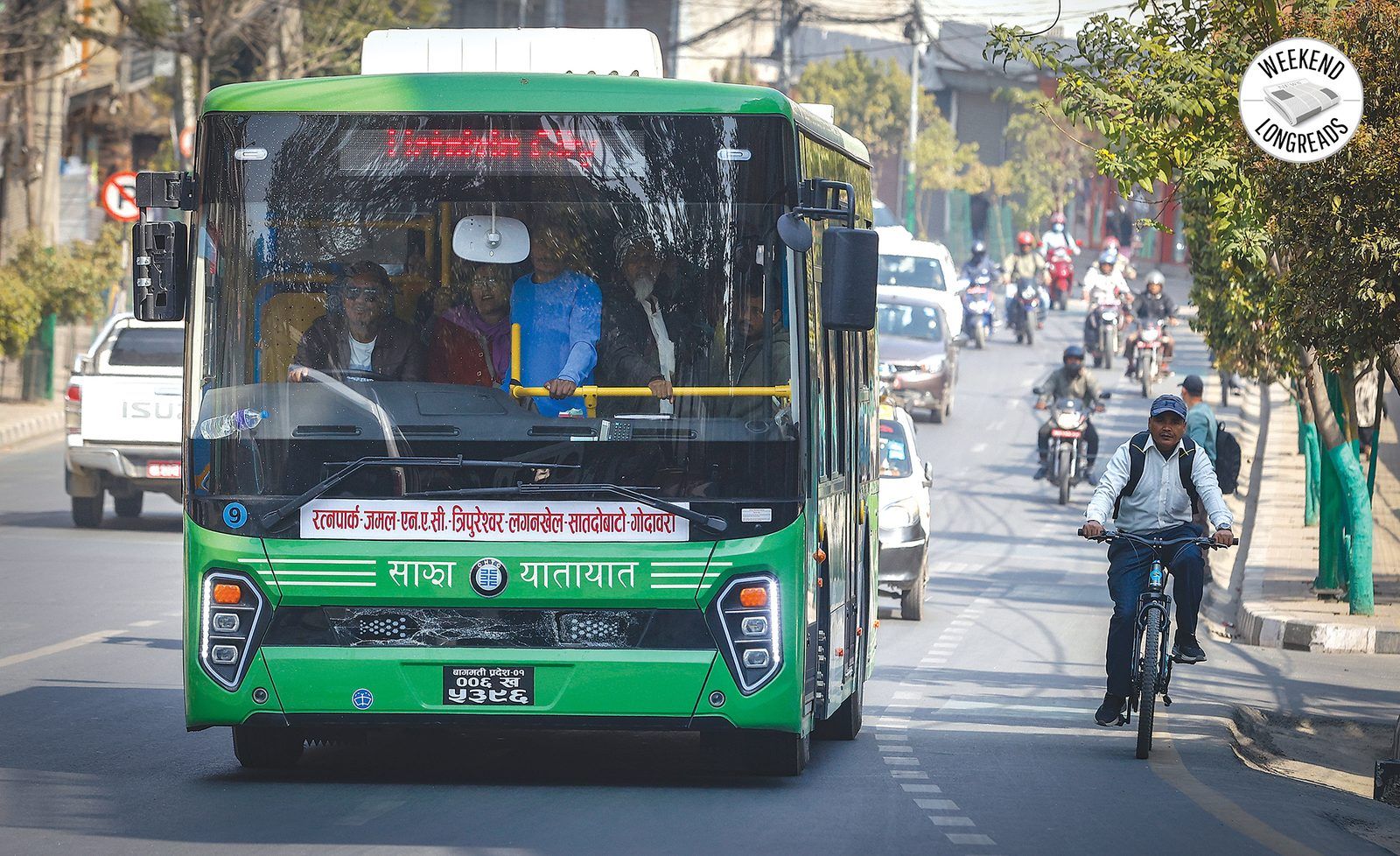 Green Sajha Yatayat electric bus on a Kathmandu street